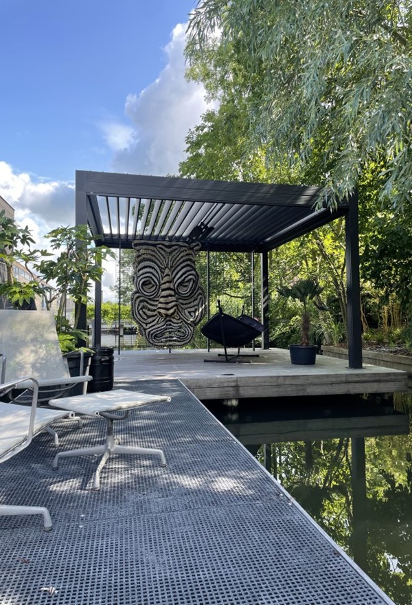 Lamellen dak met uitzicht op water Amsterdam Veldman Zonwering